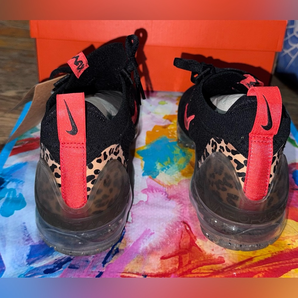 Nike Women's Animal Print Slip-On Sneakers in Black & Coral